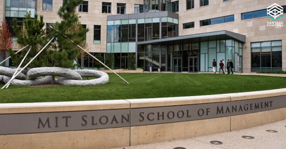 Photo of the MIT Sloan building and sign on campus