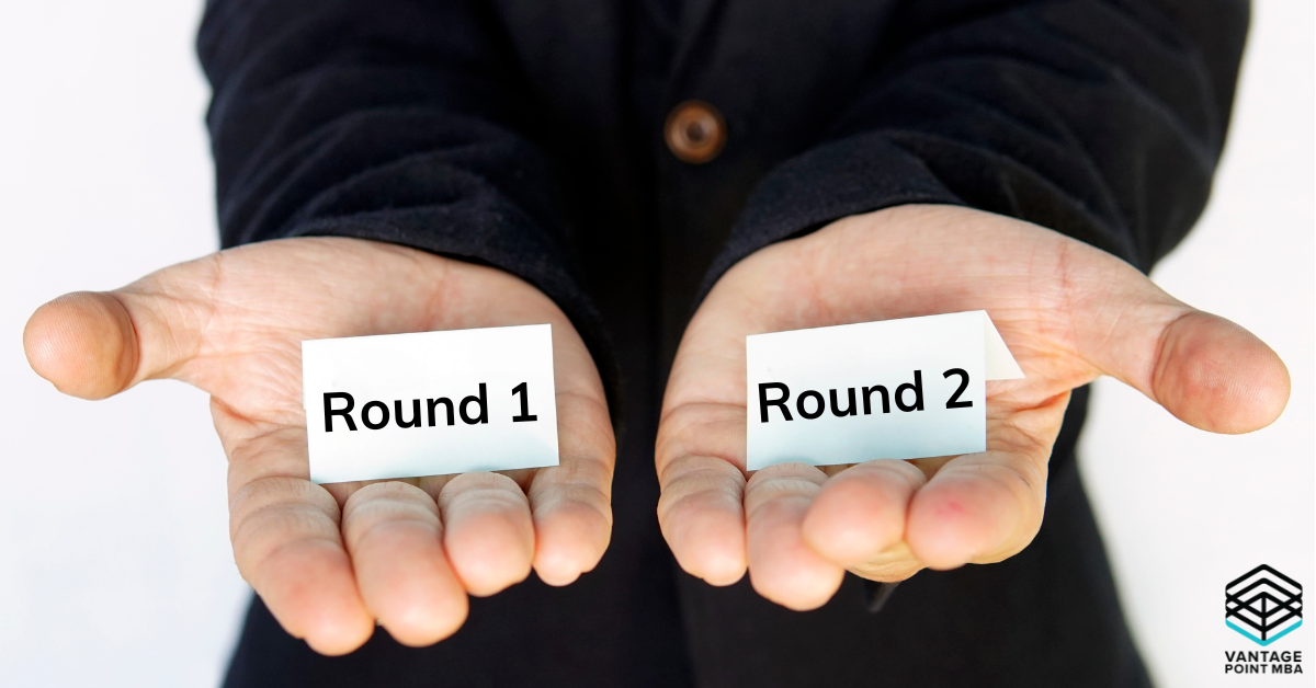 Person holding out both hands with the option of Round 1 in one hand and Round 2 in the other hand.
