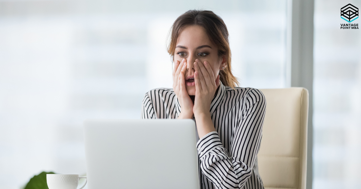 Business school applicant reading MBA admissions rejection email